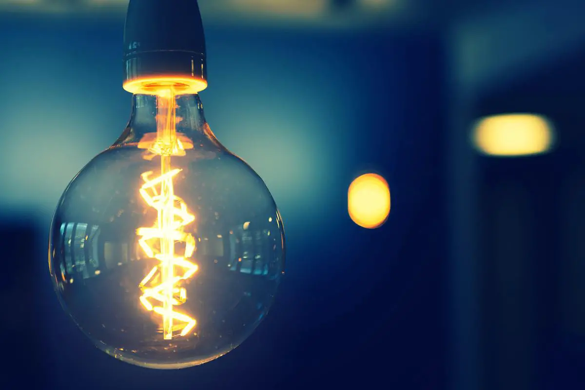 Image of a person with a lightbulb representing entrepreneurial thinking