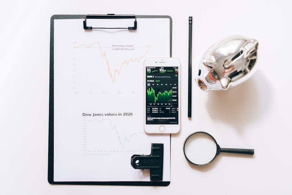 A piggy bank and coins with a calculator, symbolizing personal finance management