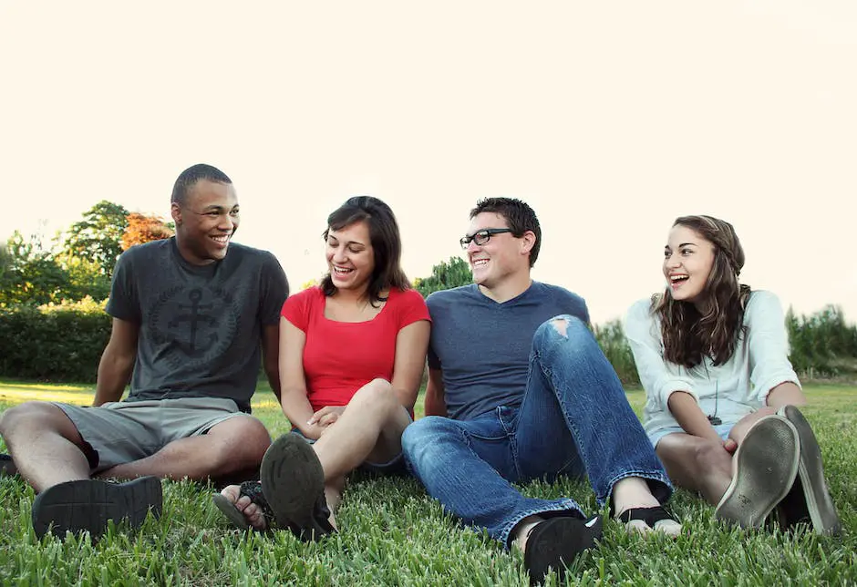 A group of young people are gathered around a computer screen, looking at a Reddit page about investment.